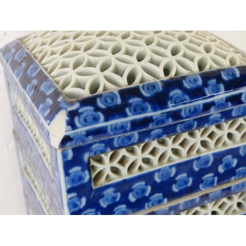 87 - A set of four Oriental style stacking boxes (a/f).