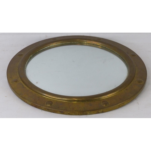 90 - A vintage nautical style wall mirror with brass frame.