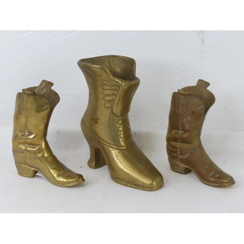 94 - Three ornamental brass boots.