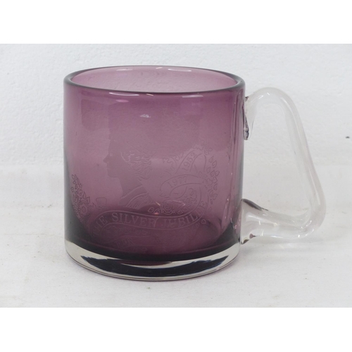 97 - A cranberry glass commemorative tankard celebrating 'The Silver Jubilee'.