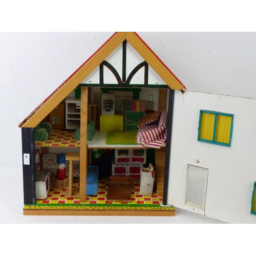 99 - A hand painted dolls house.