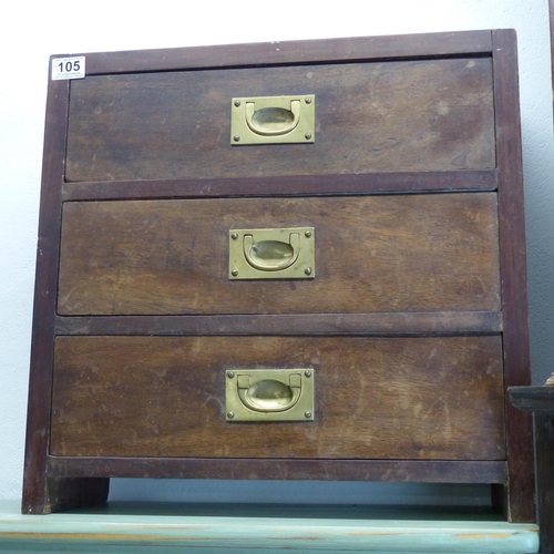 105 - A small oak chest of three drawers with brass pulls.