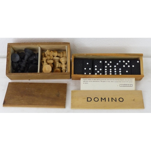 107 - A cased set of Domino's and a cased set of wooden chess pieces.