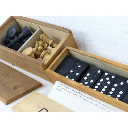 107 - A cased set of Domino's and a cased set of wooden chess pieces.