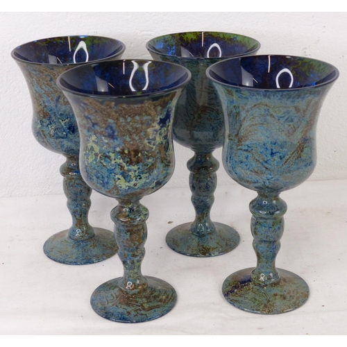 111 - Four coloured glass wine glasses.