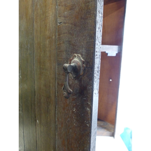 119 - An oak corner cabinet.
