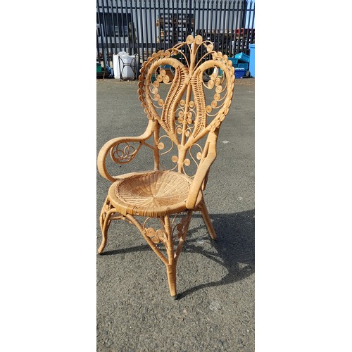 66 - A stunning vintage peacock chair.