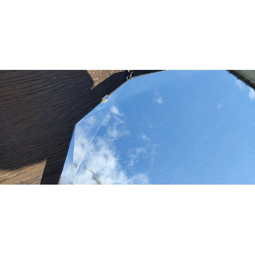 77 - A frameless Art Deco mirror with geometric bevelled glass patterns.