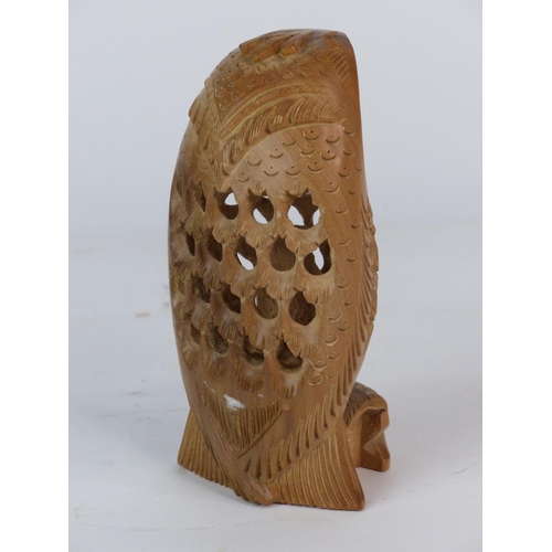 101 - An unusual wood carving of an owl. Measuring 14cm tall.