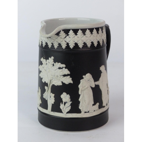 130 - A rare Hanley Brothers black glazed jug with Classical figures (a/f).