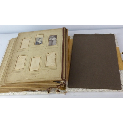 141 - An antique photo album with contents.