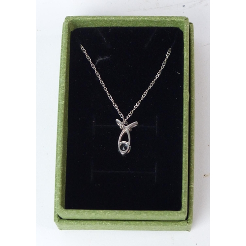 147 - A Sterling silver pendant and necklace set.