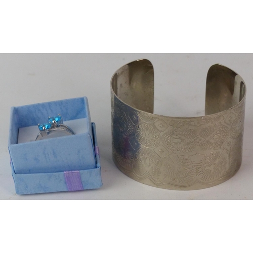 150 - A metal cuff bangle and a dress ring, size N/O.