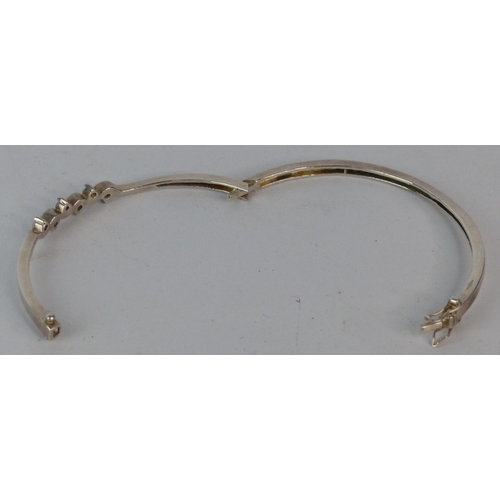 163 - A Sterling silver bangle.