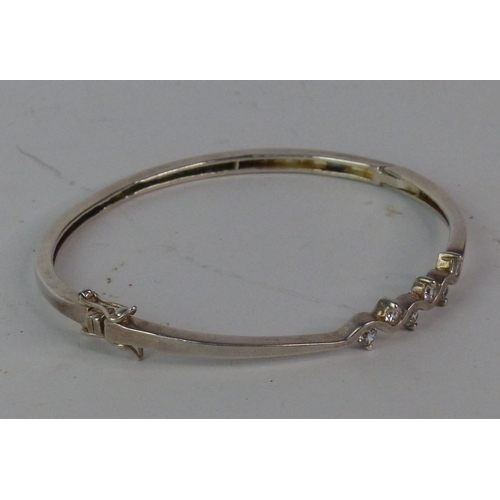 163 - A Sterling silver bangle.