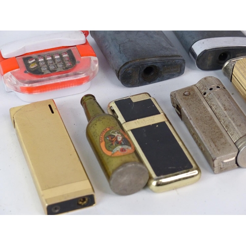 174 - A collection of vintage & antique lighters.