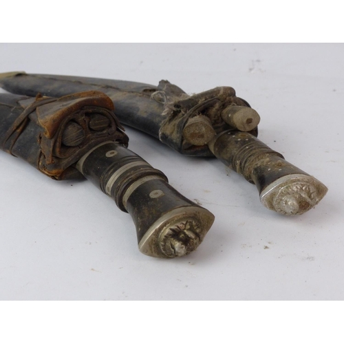 183 - Two vintage Kukri knife with wooden handle and accompanying knives in a leather sheaths. Each measur... 