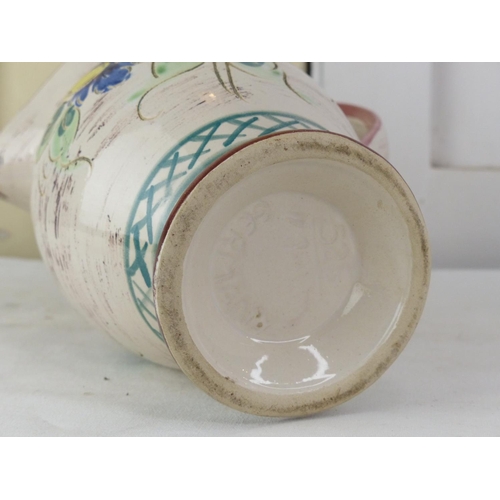 279 - A vintage German pottery floral patterned jug.