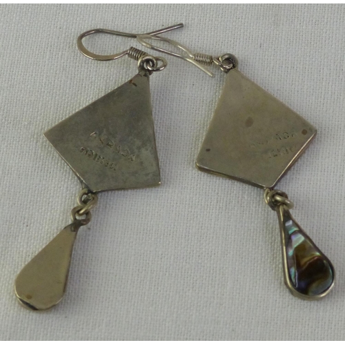 28 - A pair of Mexican silver earrings.