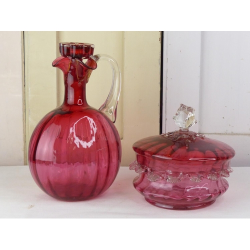 296 - An antique ruby glass decanter and lidded bowl (a/f).