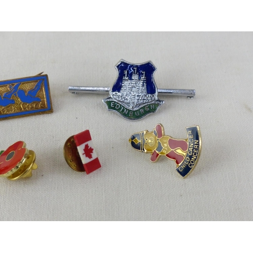 38 - A collection of Poppy pin badges and more.