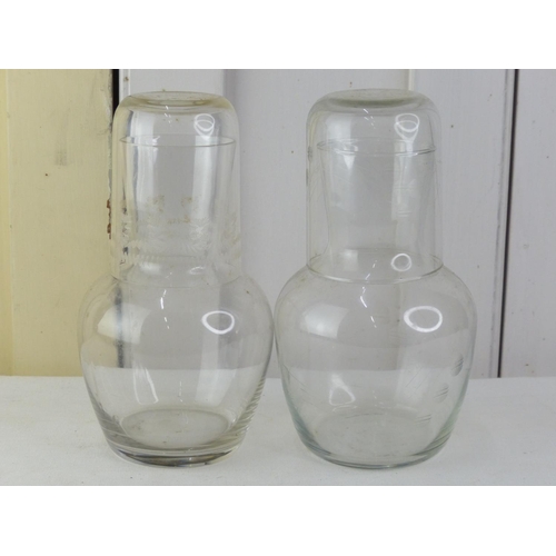 44 - Two etched glass carafes.