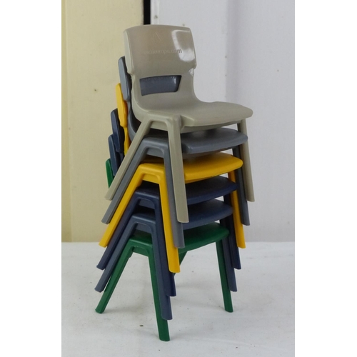 15 - A set of six plastic stacking chairs for a dolls house.