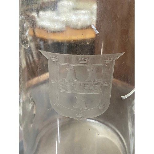 34 - An antique two handled vase with crest detail.