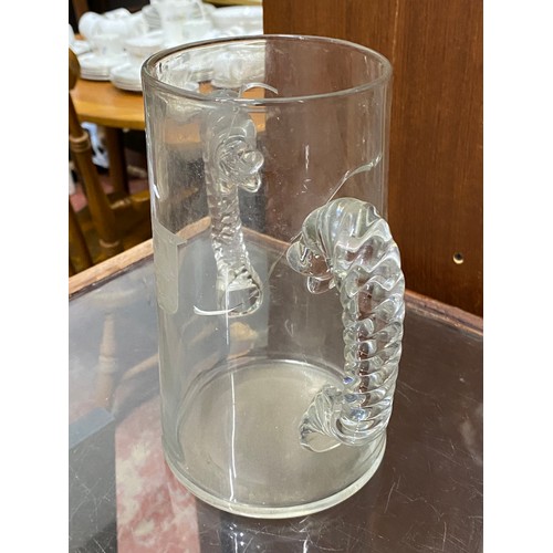 34 - An antique two handled vase with crest detail.