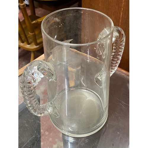 34 - An antique two handled vase with crest detail.