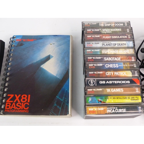 A vintage Sinclair ZX81 Basic console, games and manual.