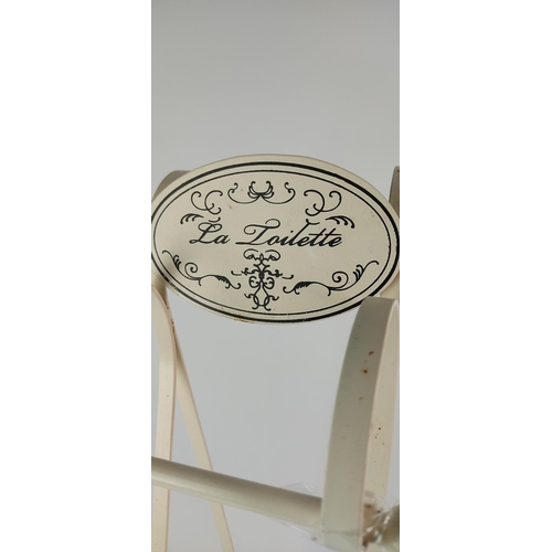 384 - A vintage style 'La Toilette' metal toilet roll holder.