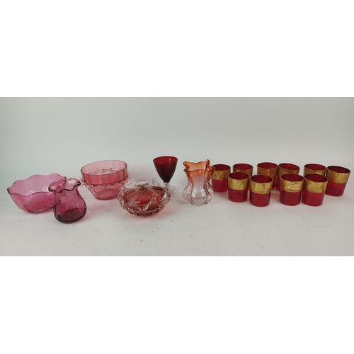 397 - A set of ten ruby and gilt glasses and other ruby glass.