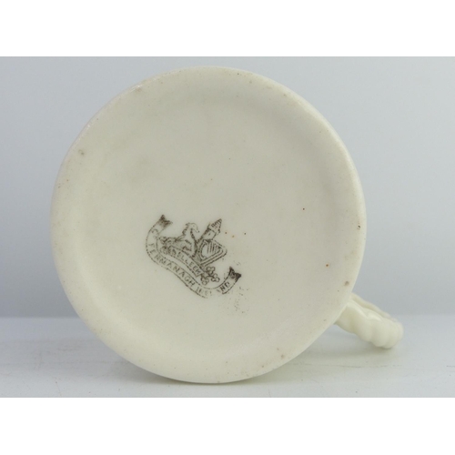24 - A decorative Belleek 2nd Period mug.