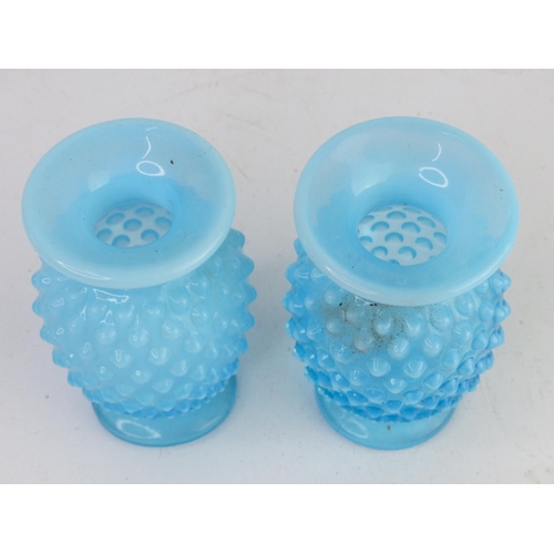 32 - A pair of vintage blue glass vases with hobnail design.