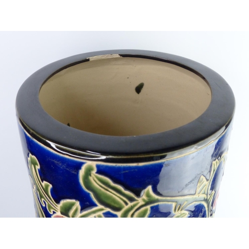 4 - A large decorative ceramic stick stand with floral design. 49cm tall