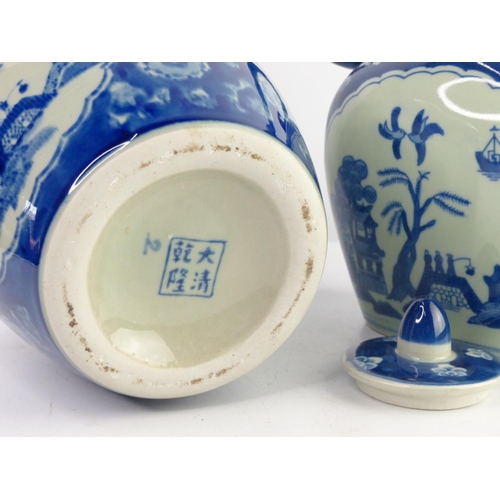 48 - A pair of antique style blue & white decorative ceramics, to include a ginger jar & jug.