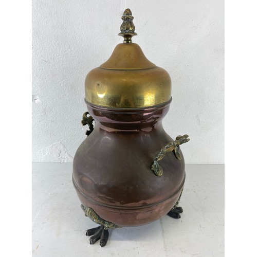 3 - An antique copper & brass urn. 43cm