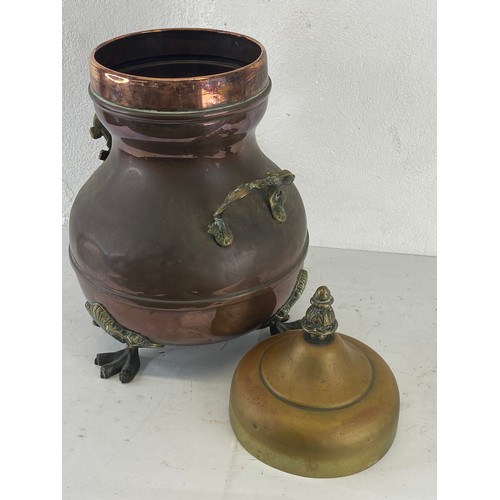 3 - An antique copper & brass urn. 43cm