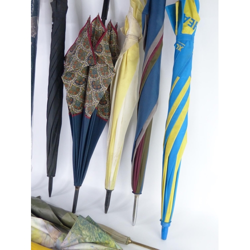 16 - A lot of assorted umbrellas.