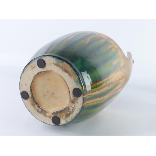 21 - A stoneware glazed planter in the style of a bucket, 30cm.