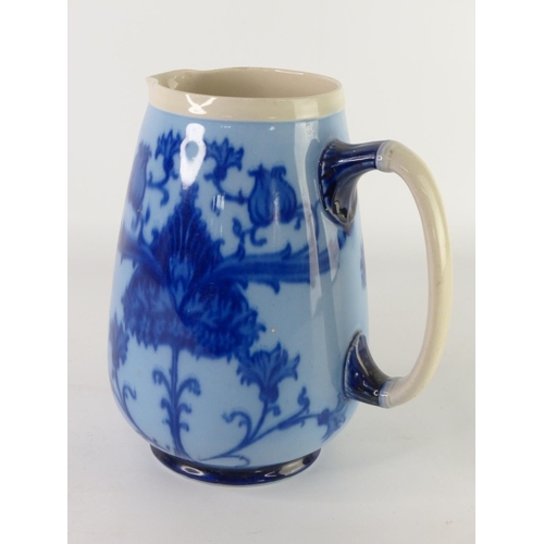 31 - A vintage Paramount Pottery jug with bird handle and another blue patterned jug (a/f).