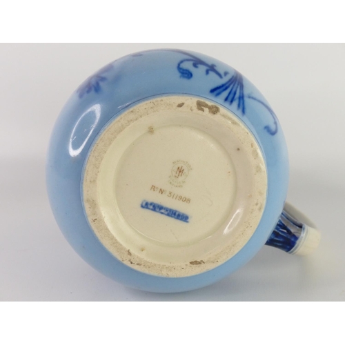 31 - A vintage Paramount Pottery jug with bird handle and another blue patterned jug (a/f).