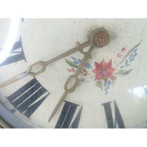 46 - An antique wag at the wall clock.