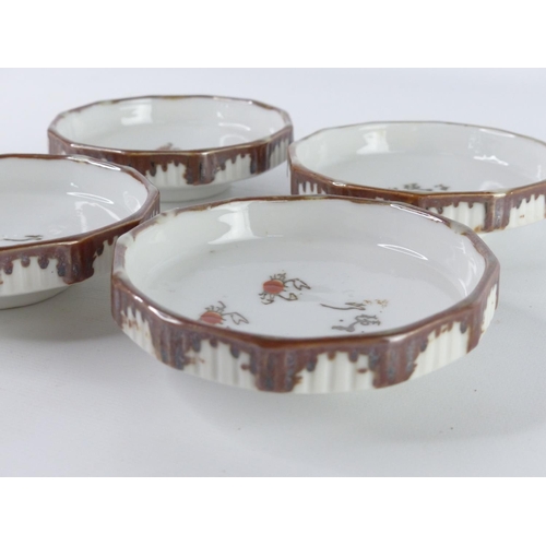 56 - Four Japanese ceramic saucers wit crab design.