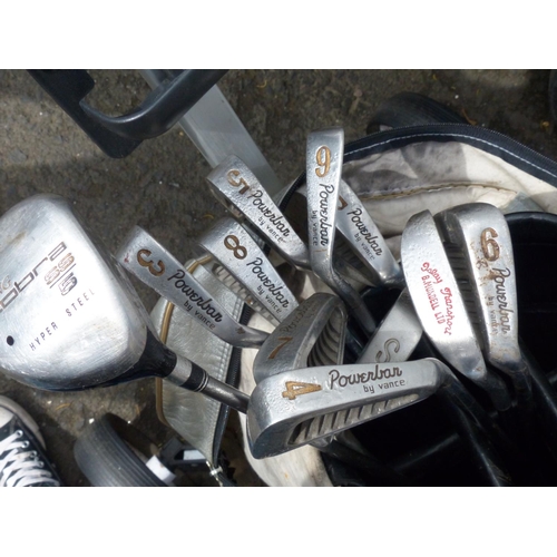 8 - A golf bag, trolley and a collection of Powerbar by Vance clubs and more.