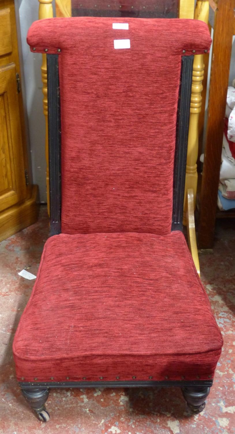 An antique upholstered 'Prayer' chair.