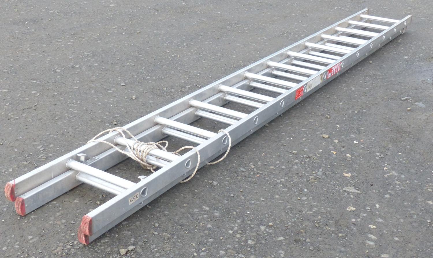 A set of extending metal ladders.