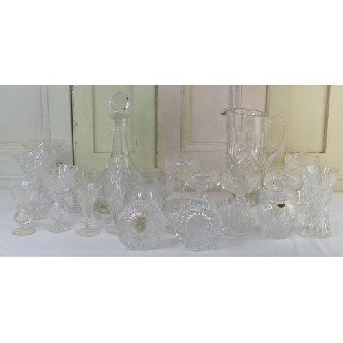 17 - A large assortment of crystal to include a set of three Tyrone crystal vases, a ships decanter, a Ty... 