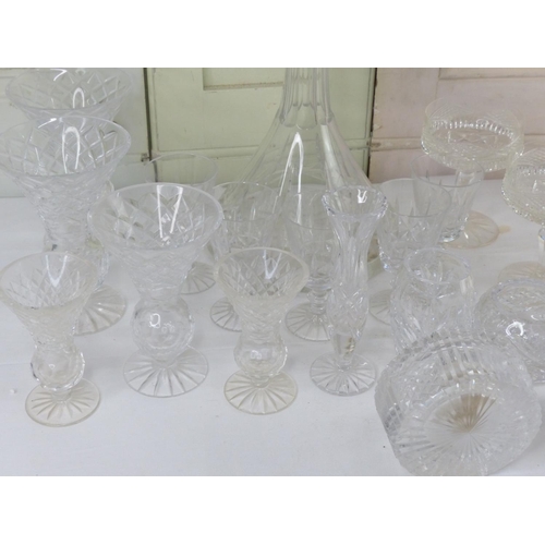 17 - A large assortment of crystal to include a set of three Tyrone crystal vases, a ships decanter, a Ty... 